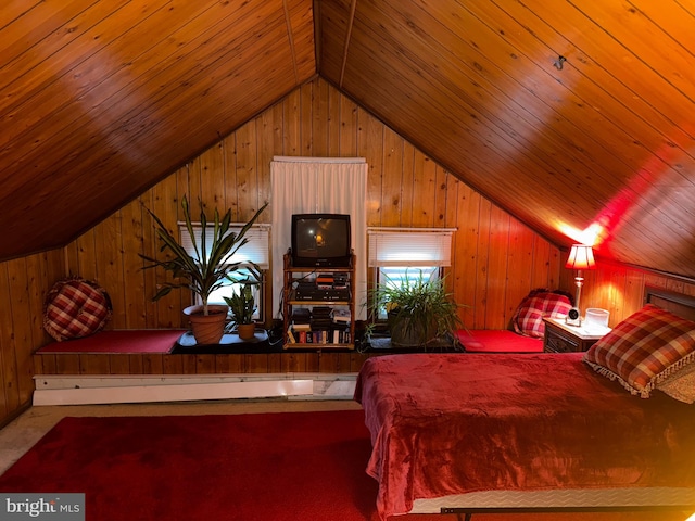 carpeted bedroom featuring lofted ceiling, wood walls, and wooden ceiling