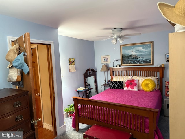 bedroom featuring hardwood / wood-style floors and ceiling fan