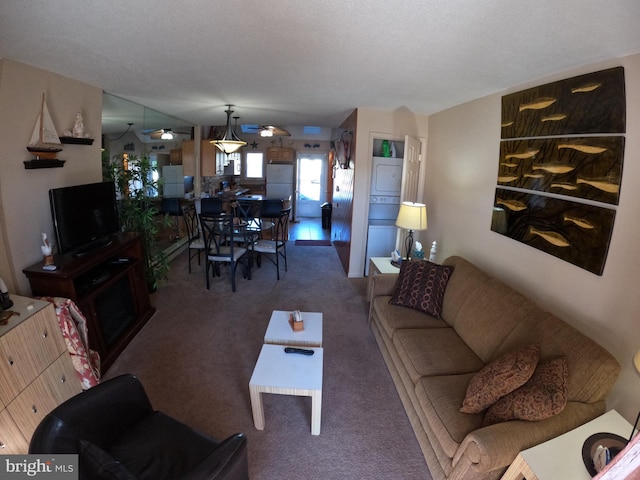 carpeted living room with a textured ceiling