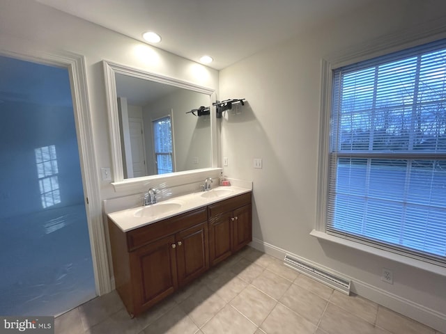 bathroom with tile patterned flooring and vanity