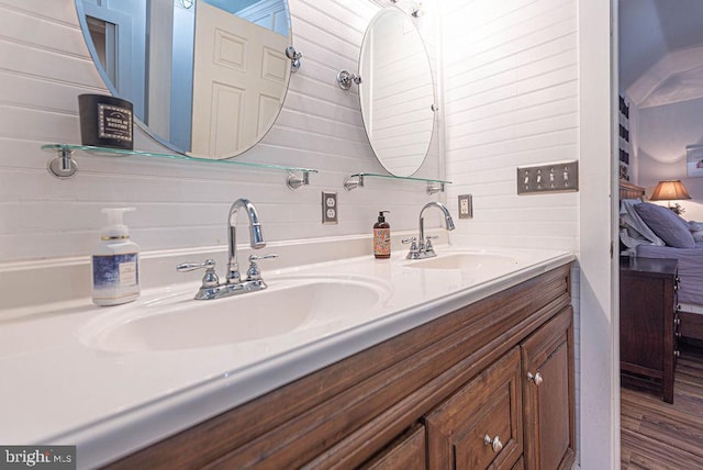 bathroom with vanity and hardwood / wood-style floors