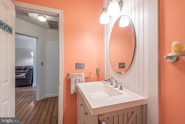 bathroom with vanity and wood-type flooring