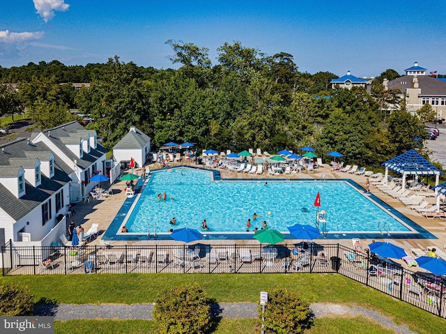 view of pool featuring a patio, a gazebo, and a yard