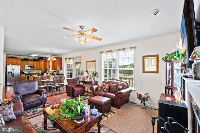 living room with light carpet and ceiling fan