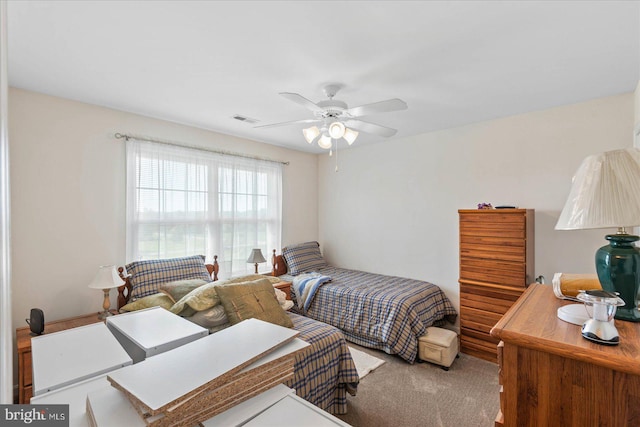 bedroom with ceiling fan and carpet flooring