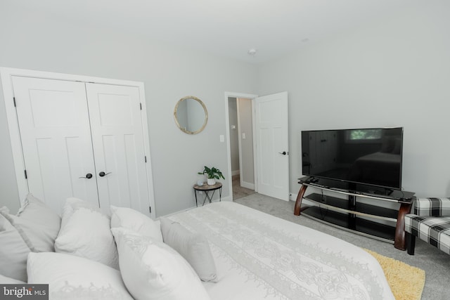 carpeted bedroom with a closet