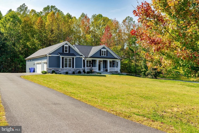 view of front of house with a porch and a front lawn