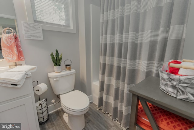 full bathroom with wood-type flooring, vanity, toilet, and shower / bath combo