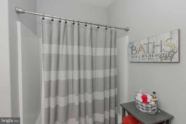 bathroom with a shower with curtain