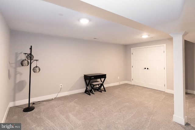 basement featuring light colored carpet