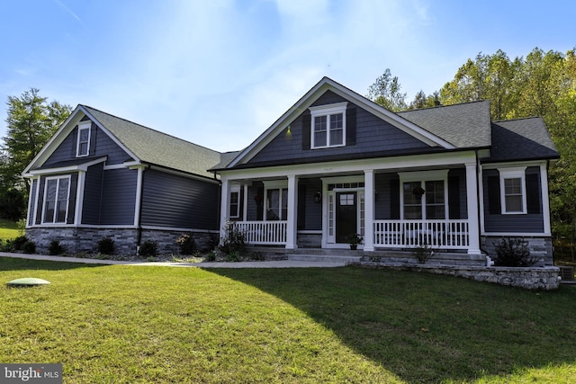 view of front of property with a front yard and a porch