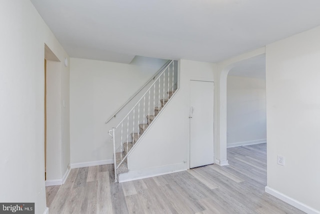 staircase with wood-type flooring