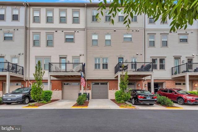 view of front facade featuring a balcony and a garage