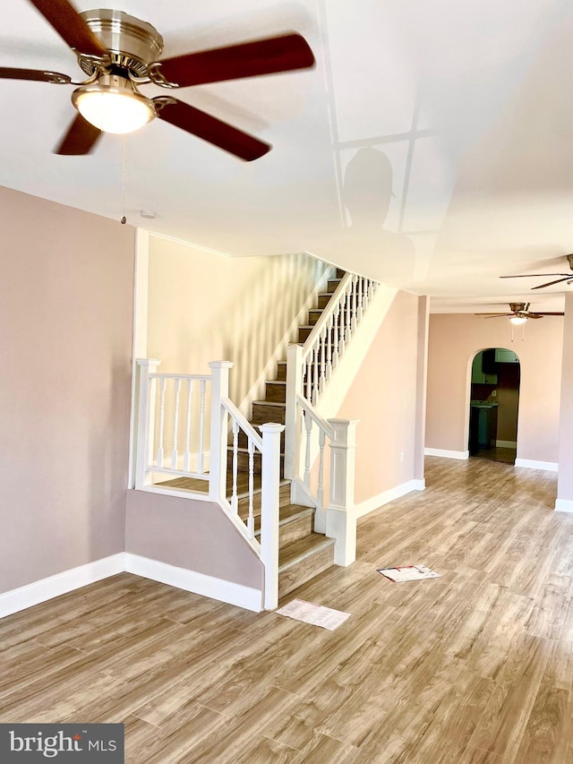 stairway featuring hardwood / wood-style floors