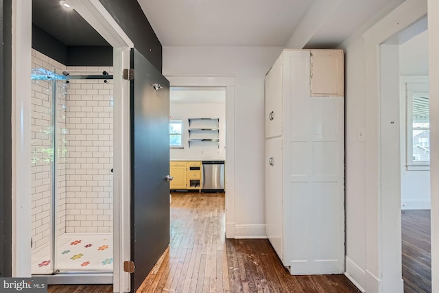 hall with dark hardwood / wood-style flooring