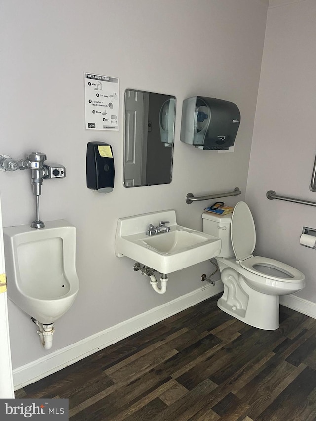 bathroom featuring hardwood / wood-style floors and toilet