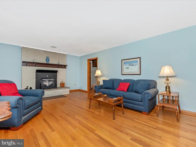 living room with baseboards and light wood finished floors