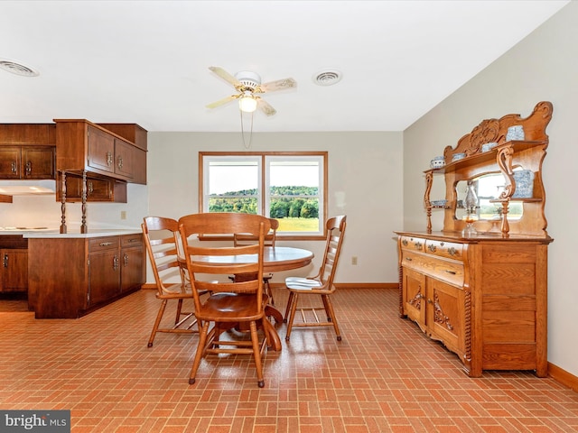 dining space featuring ceiling fan