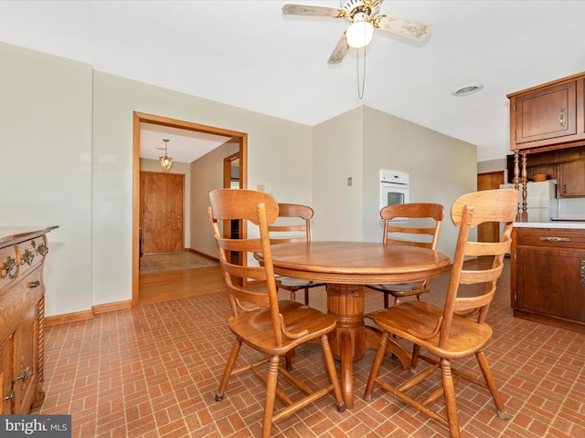 dining space with ceiling fan