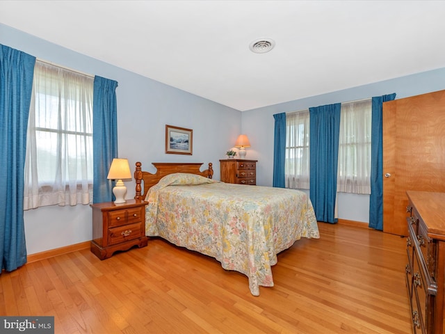 bedroom with light wood-type flooring