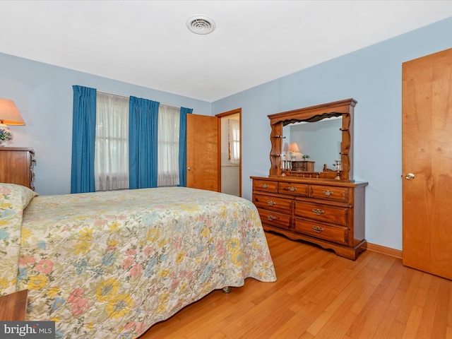 bedroom with hardwood / wood-style flooring