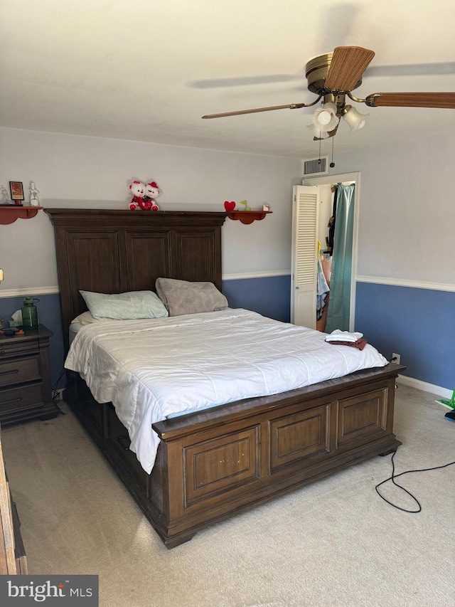 carpeted bedroom with ceiling fan