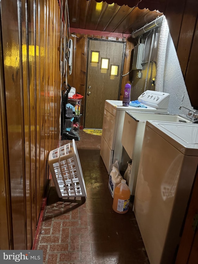 clothes washing area featuring independent washer and dryer