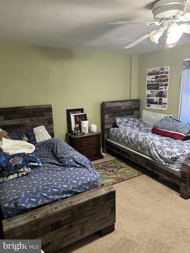 carpeted bedroom featuring ceiling fan