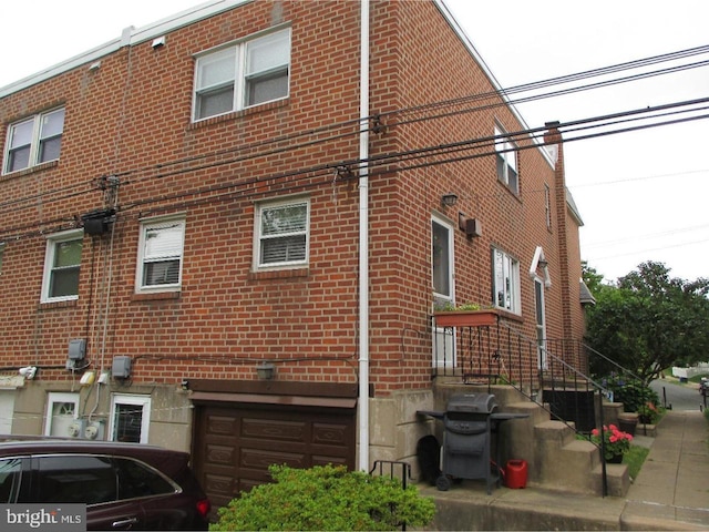 view of side of property with a garage