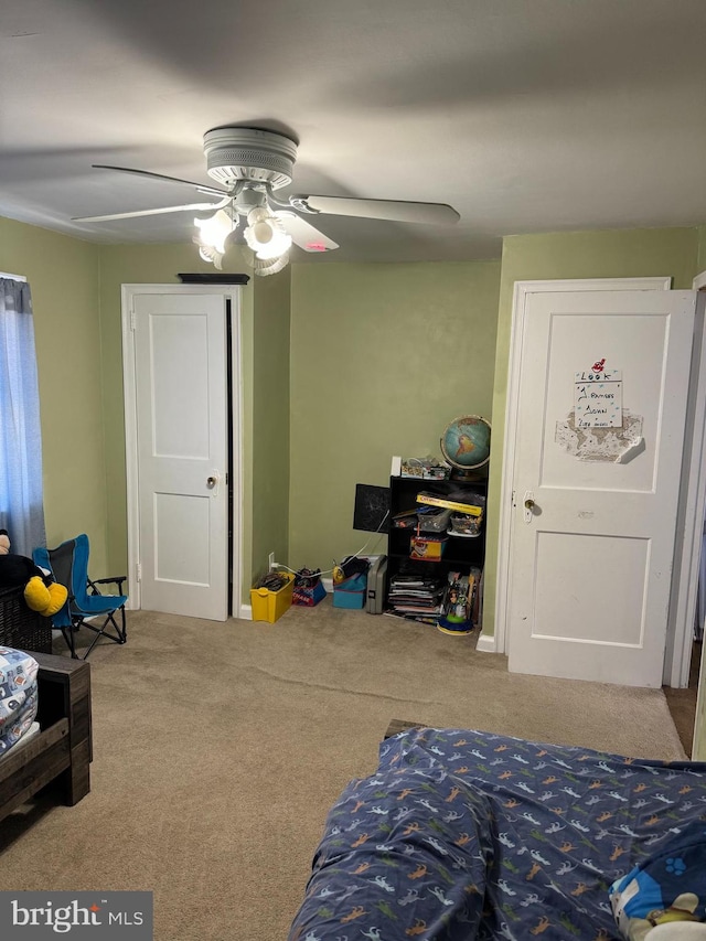 bedroom featuring ceiling fan and carpet flooring