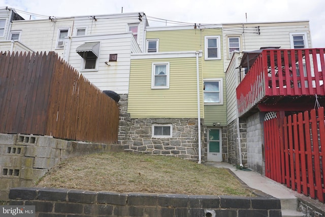 back of property featuring a deck