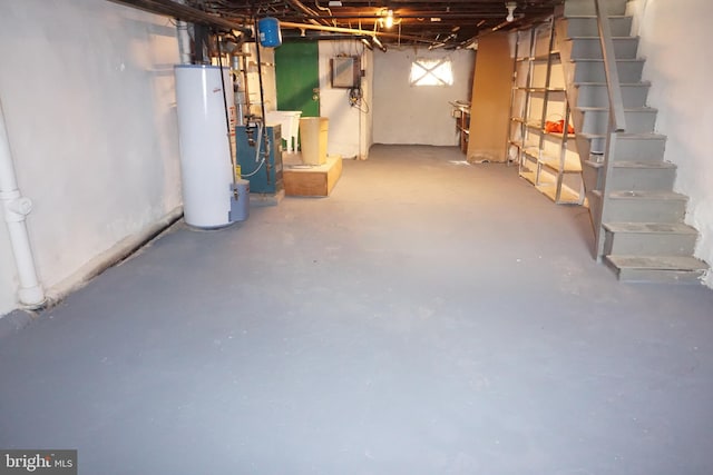 basement with electric panel and water heater