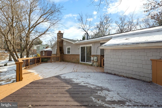 view of snow covered deck