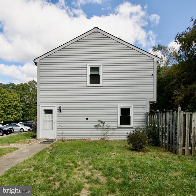 view of home's exterior with a lawn