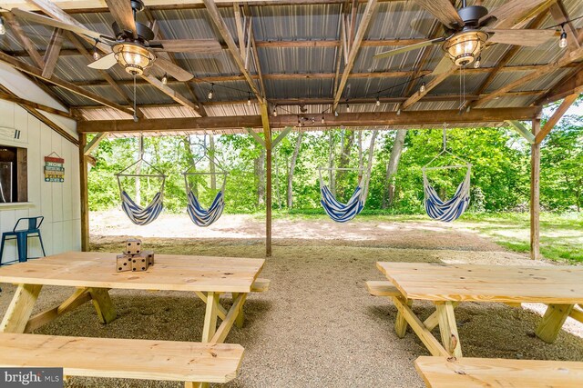 exterior space featuring ceiling fan