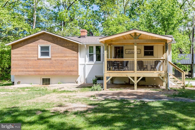 rear view of house with a lawn