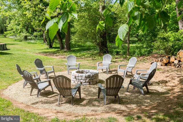 view of yard with a fire pit