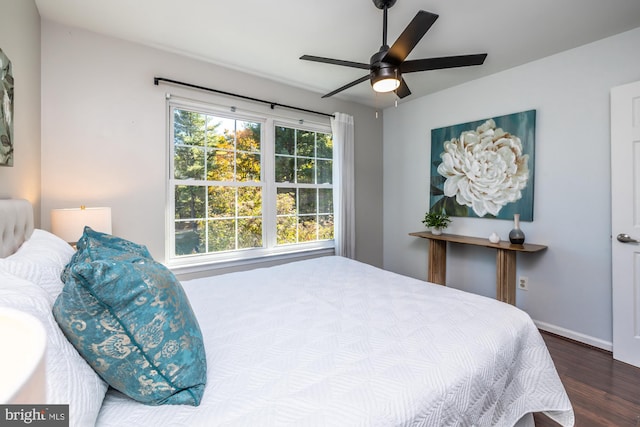 bedroom featuring hardwood / wood-style flooring and ceiling fan