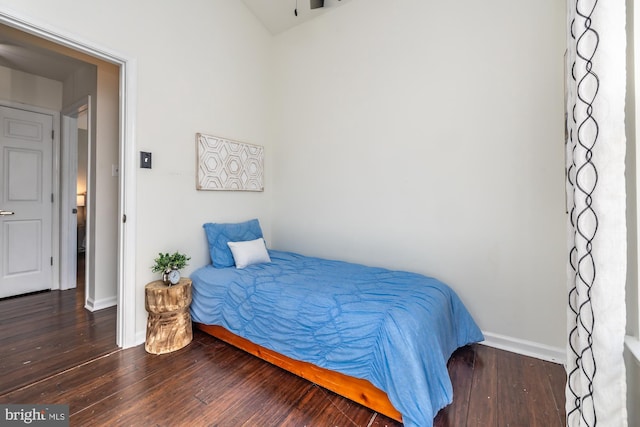 bedroom featuring dark hardwood / wood-style flooring