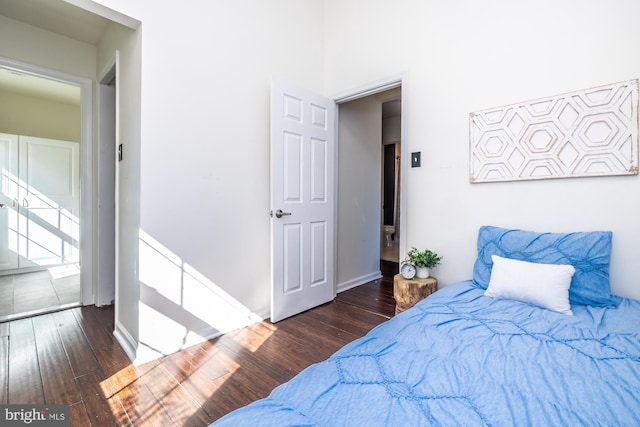 bedroom featuring dark hardwood / wood-style flooring