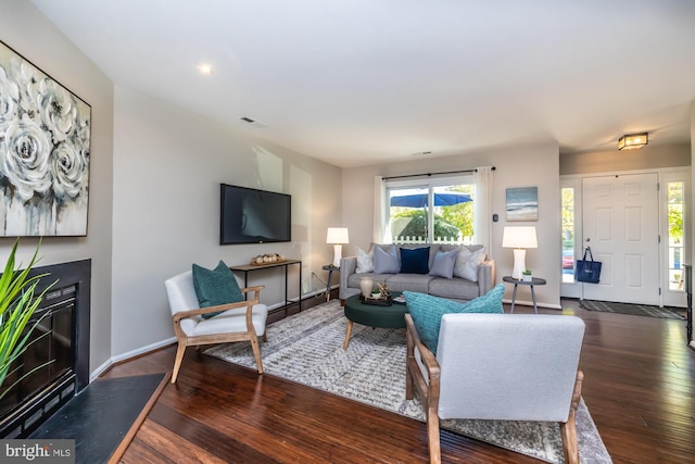 living room featuring dark hardwood / wood-style floors