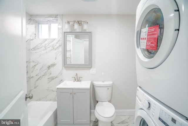 full bathroom with vanity, bathing tub / shower combination, stacked washer and dryer, and toilet