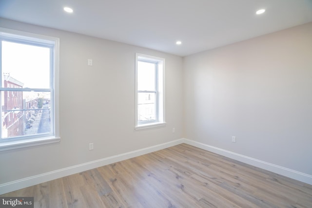 empty room featuring light hardwood / wood-style flooring and plenty of natural light