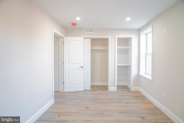 unfurnished bedroom with light hardwood / wood-style flooring