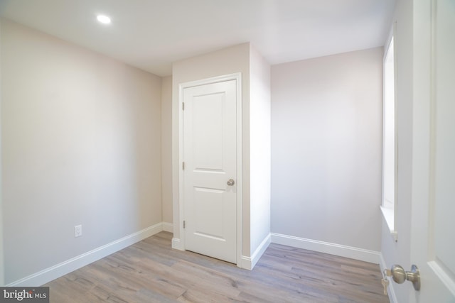 spare room featuring light wood-type flooring