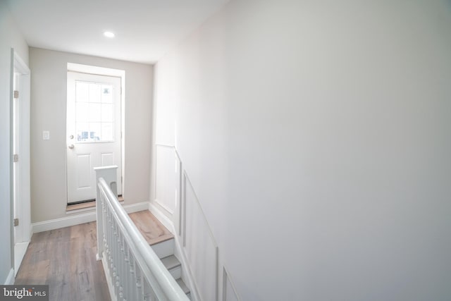 staircase with wood-type flooring