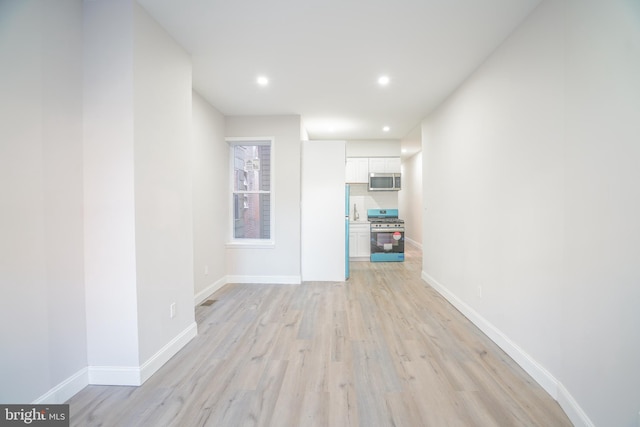 hallway featuring light hardwood / wood-style flooring