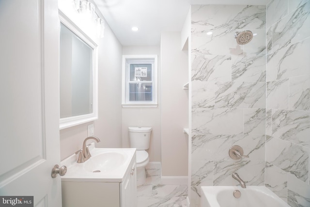 full bathroom with toilet, tiled shower / bath, and vanity