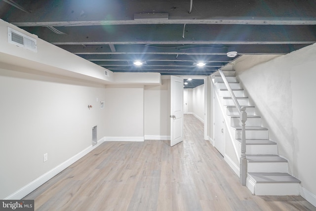 basement featuring hardwood / wood-style floors