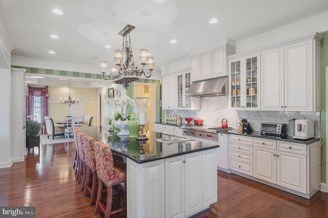 kitchen with white cabinetry and a center island